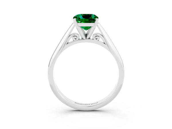 Platinum Cushion Cut Emerald Solitaire Engagement Ring with Cathedral Setting and Four-Prong Mount