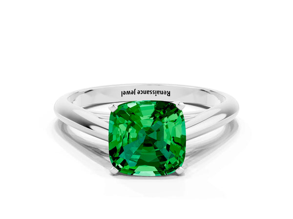 Platinum Cushion Cut Emerald Solitaire Engagement Ring with Cathedral Setting and Four-Prong Mount
