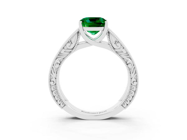 Silver Cushion Cut Emerald Solitaire Ring with Engraved Band and Four-Prong Setting
