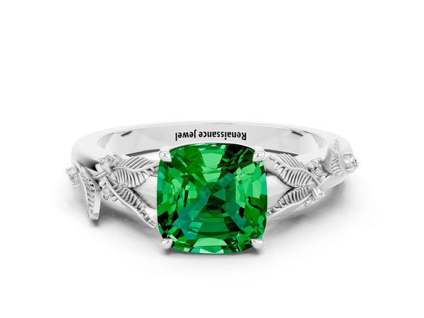 Platinum Cushion Cut Emerald Solitaire Ring with Leaf Motif Band and Four-Prong Setting