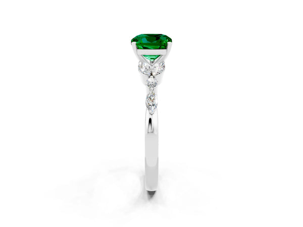 Platinum Cushion Cut Emerald Solitaire Ring with Side Stones and Four-Prong Setting