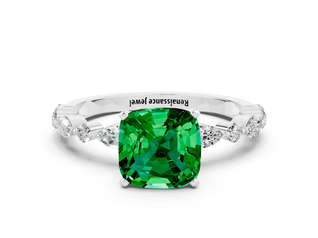 White gold Cushion Cut Emerald Solitaire with Side Stones on a Pavé Band and Four-Prong Setting