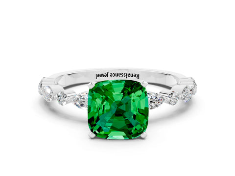 White gold Cushion Cut Emerald Solitaire with Side Stones on a Pavé Band and Four-Prong Setting