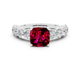 White gold Cushion Cut Garnet Prong Setting with Side Stones on a Pave Band