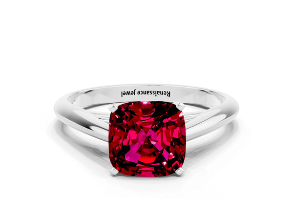 Platinum Cushion Cut Garnet Solitaire Engagement Ring with Cathedral Setting and Four-Prong Mount