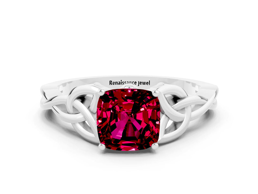 White gold Cushion Cut Garnet Solitaire Engagement Ring with Celtic Knot Band and Four-Prong Setting