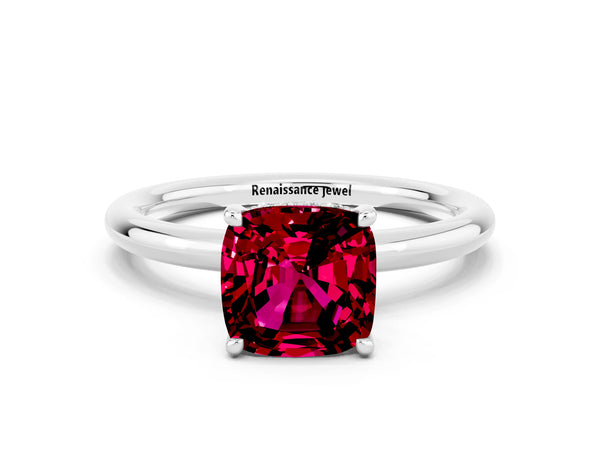 Platinum Cushion Cut Garnet Solitaire Ring with Thin Band and Four-Prong Setting