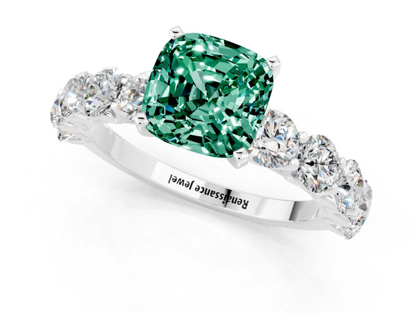 Platinum Cushion Cut Green Sapphire Prong Setting with Side Stones on a Pave Band