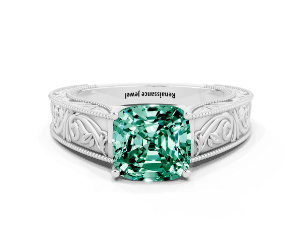 Platinum Cushion Cut Green Sapphire Solitaire Ring with Engraved Band and Four-Prong Setting