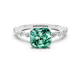 White gold Cushion Cut Green Sapphire Solitaire with Side Stones on a Pavé Band and Four-Prong Setting