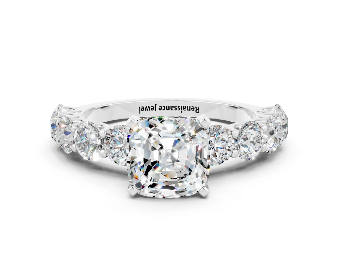 White gold Cushion Cut Moissanite Prong Setting with Side Stones on a Pave Band