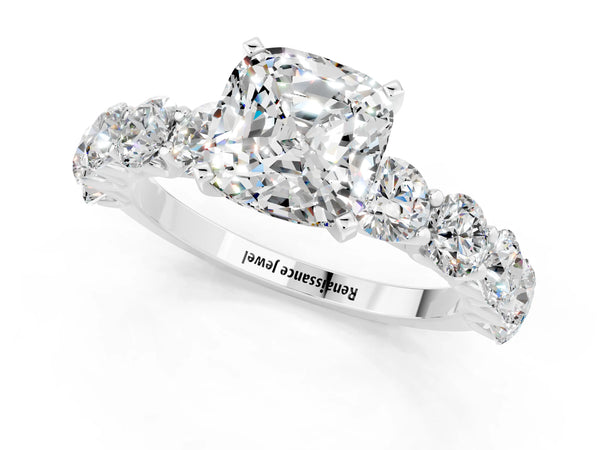 White gold Cushion Cut Moissanite Prong Setting with Side Stones on a Pave Band