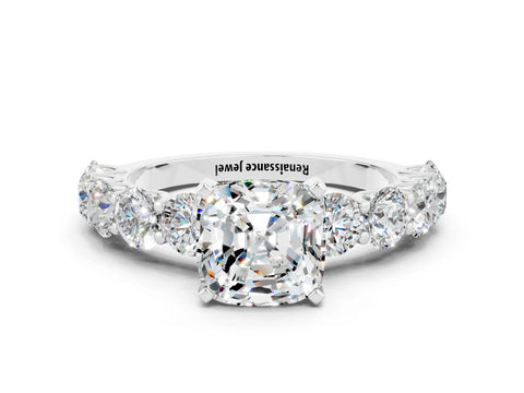 White gold Cushion Cut Moissanite Prong Setting with Side Stones on a Pave Band