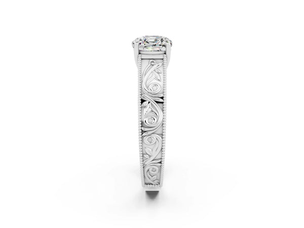 Platinum Cushion Cut Moissanite Solitaire Ring with Engraved Band and Four-Prong Setting