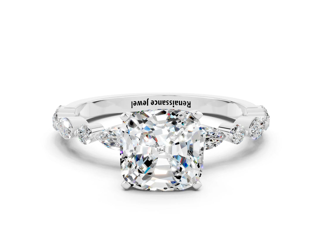 White gold Cushion Cut Moissanite Solitaire with Side Stones on a Pavé Band and Four-Prong Setting