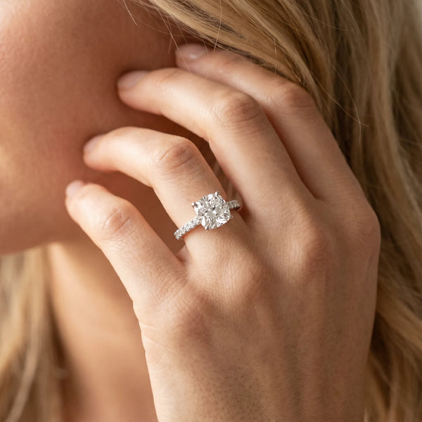 White gold Cushion Cut Solitaire Diamond Ring with Pave Band and Four-Prong Setting