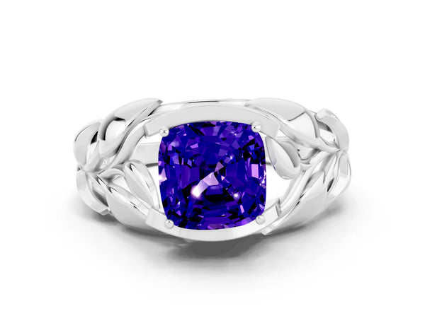Platinum Cushion Cut Tanzanite Leaf-Inspired Engagement Ring with Round Accents and Prong Setting