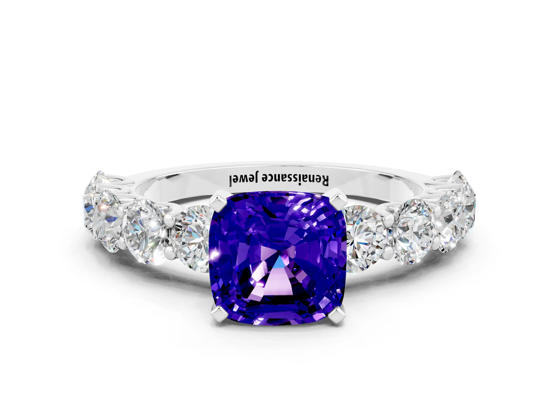 White gold Cushion Cut Tanzanite Prong Setting with Side Stones on a Pave Band