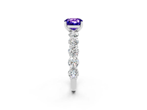 Silver Cushion Cut Tanzanite Prong Setting with Side Stones on a Pave Band