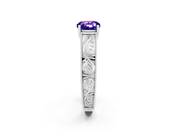 Platinum Cushion Cut Tanzanite Solitaire Ring with Engraved Band and Four-Prong Setting