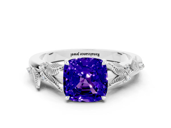 Platinum Cushion Cut Tanzanite Solitaire Ring with Leaf Motif Band and Four-Prong Setting
