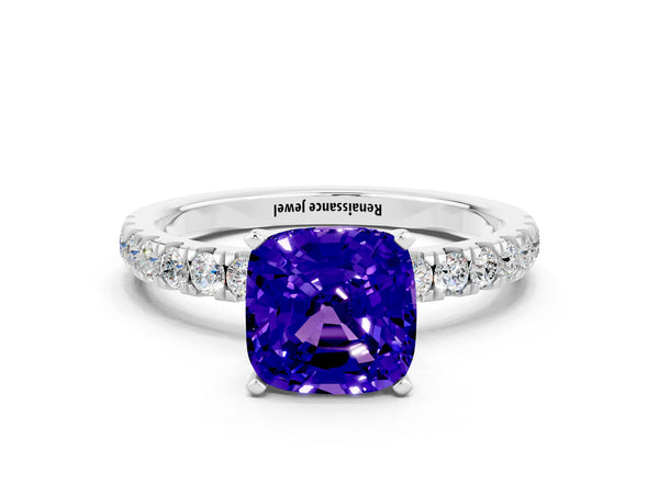 Platinum Cushion Cut Tanzanite Solitaire Ring with Pavé Accents and Four-Prong Setting