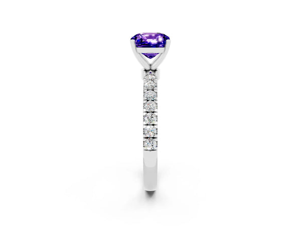 Platinum Cushion Cut Tanzanite Solitaire Ring with Pavé Accents and Four-Prong Setting