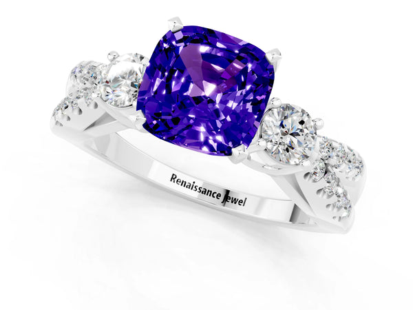 Platinum Cushion Cut Tanzanite Three-Stone Ring with Pavé Split Shank and Four-Prong Setting