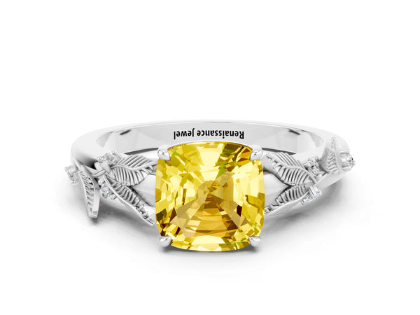 Platinum Cushion Cut Yellow Sapphire Solitaire Ring with Leaf Motif Band and Four-Prong Setting