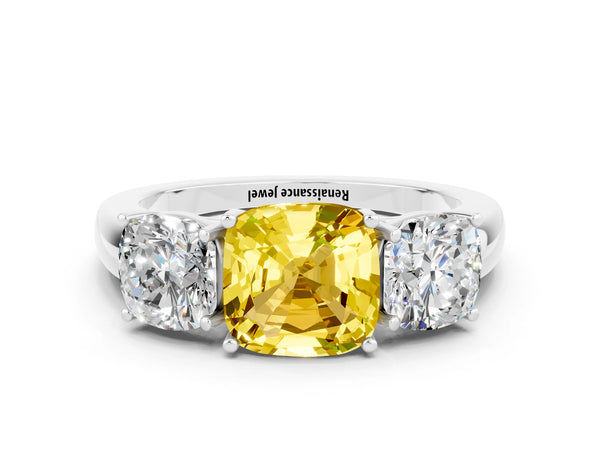 Platinum Cushion Cut Yellow Sapphire Three-Stone Ring with Four-Prong Setting and Classic Band