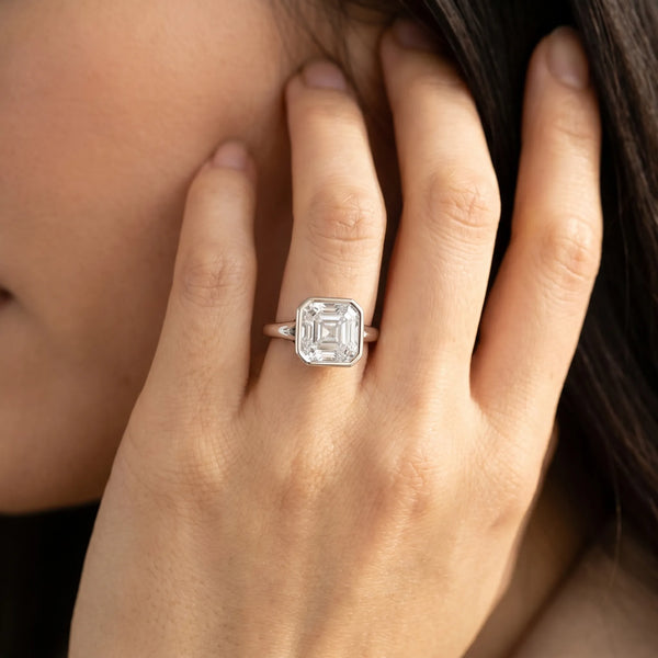 White gold Cushion Diamond Solitaire Ring with Bezel Setting and Classic Band