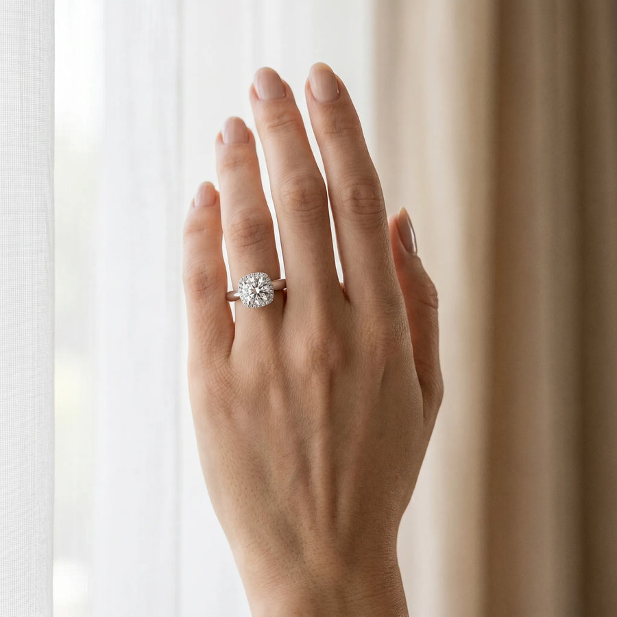 White gold Cushion Halo Round Brilliant Solitaire Ring with Tapered Band and Four-Prong Setting