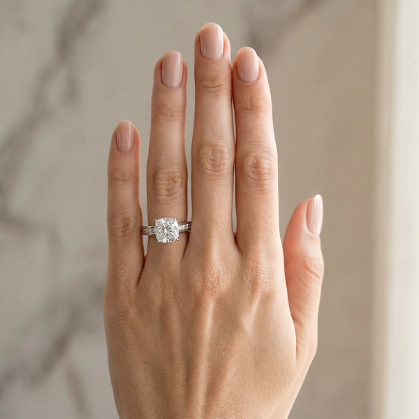 White gold Cushion Solitaire Diamond Ring with Channel-Set Band and Four-Prong Setting