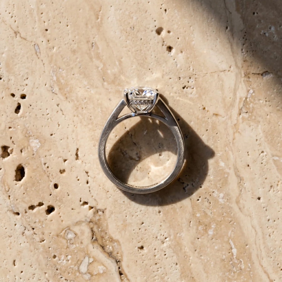 White gold Cushion Solitaire Engagement Ring with Four-Prong Setting and Tapered Band