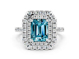 White gold Double Halo Emerald Cut Blue Topaz Pavé Band with Four-Prong Setting