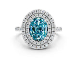 White gold Double Halo Oval Cut Blue Topaz Pavé Band with Four-Prong Setting