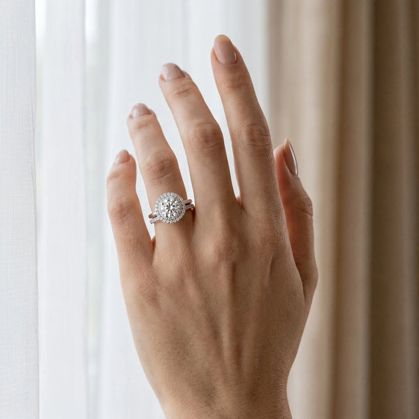 White gold Double Halo Round Diamond Solitaire with Pavé Band and Four-Prong Setting