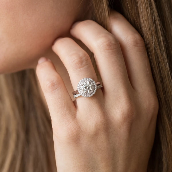 White gold Double Halo Round Diamond Solitaire with Pavé Band and Four-Prong Setting