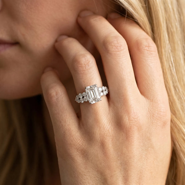 White gold Emerald Cluster Diamond Engagement Ring with Pavé Band and Four-Prong Setting