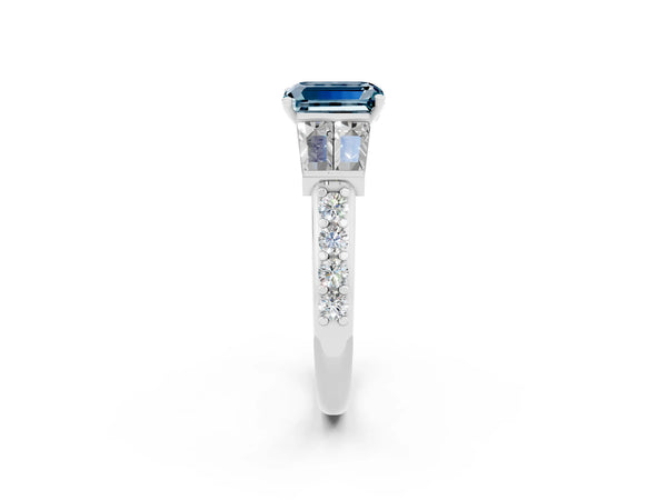 Silver Emerald Cut Aquamarine Engagement Ring with Baguette Side Stones and Channel Set Band