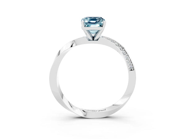 Silver Emerald Cut Aquamarine Engagement Ring with Side Stone Accents and Four-Prong Setting