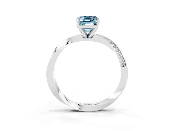 White gold Emerald Cut Aquamarine Engagement Ring with Side Stone Accents and Four-Prong Setting