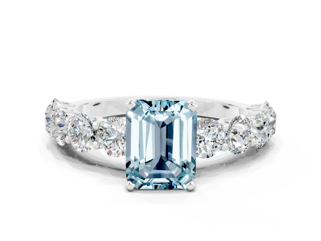 White gold Emerald Cut Aquamarine Prong Setting with Side Stones on a Pave Band