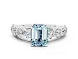 White gold Emerald Cut Aquamarine Prong Setting with Side Stones on a Pave Band