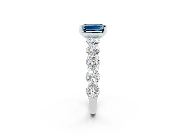 White gold Emerald Cut Aquamarine Prong Setting with Side Stones on a Pave Band