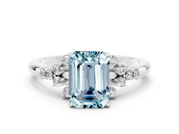 Platinum Emerald Cut Aquamarine Ring with Side Stones and Four-Prong Setting