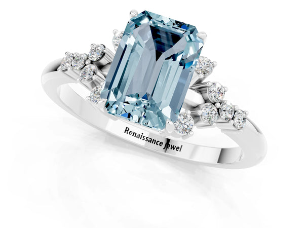 Silver Emerald Cut Aquamarine Ring with Side Stones and Four-Prong Setting