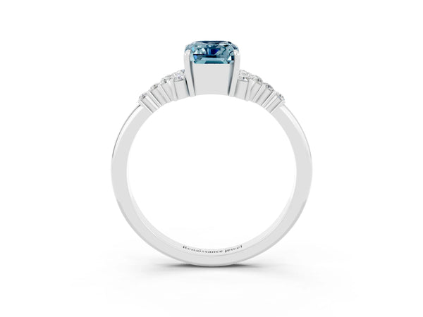 Platinum Emerald Cut Aquamarine Ring with Side Stones and Four-Prong Setting