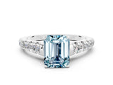 White gold Emerald Cut Aquamarine Solitaire Ring with Cathedral Setting and Pavé Band