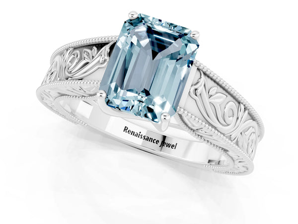 White gold Emerald Cut Aquamarine Solitaire Ring with Engraved Band and Four-Prong Setting